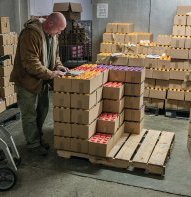 A driver checking out one of his drinkable yogurt orders. In the winter, when it’s cold, the drivers fulfill their orders themselves in the warehouse.